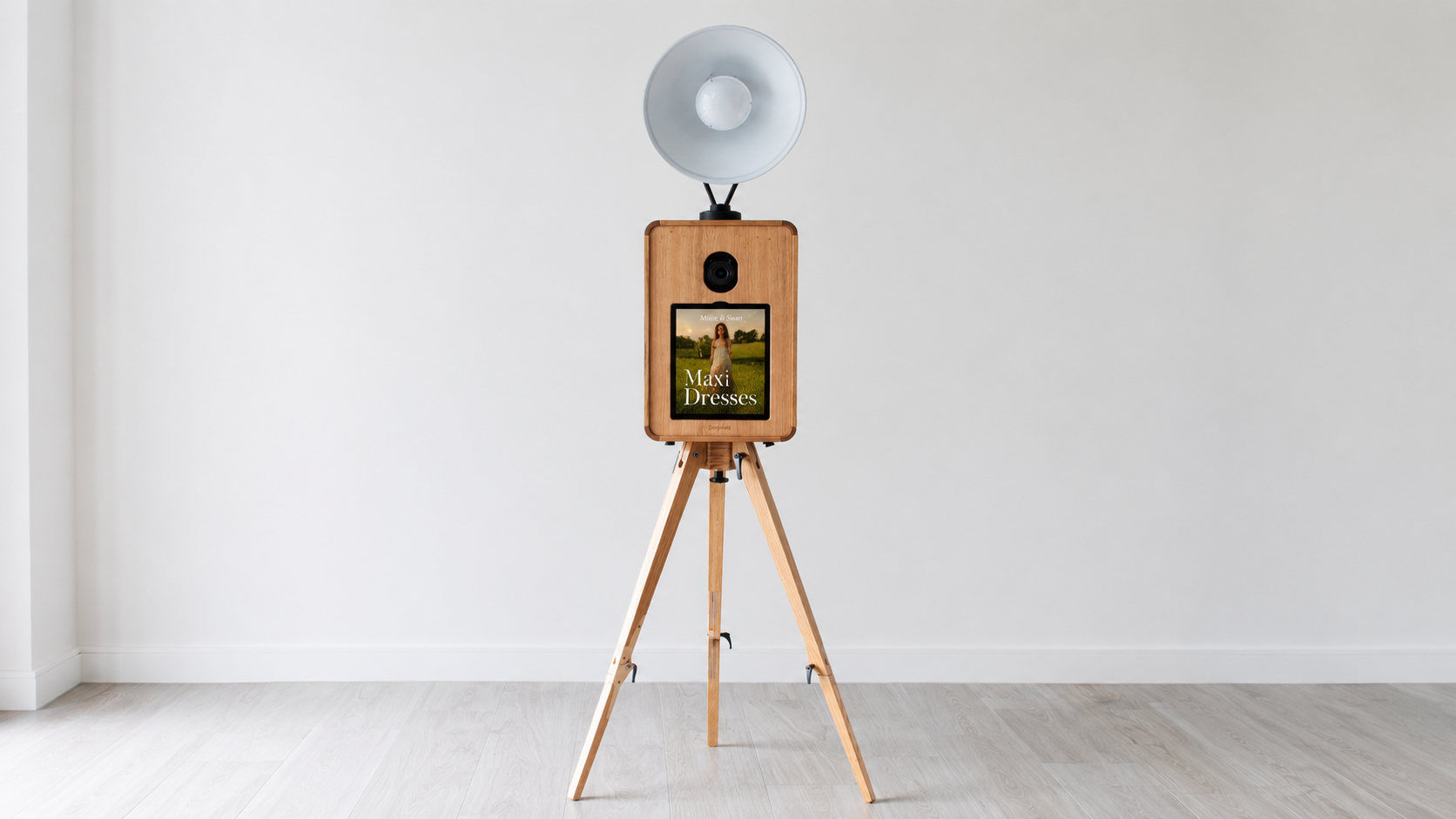 Luxury wooden digital photo booth with tripod stand and ring light setup for upscale weddings, corporate events, and private celebrations.