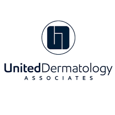 United Dermatology Associates logo featuring a circular navy-blue monogram icon above the company name on a light gray background.