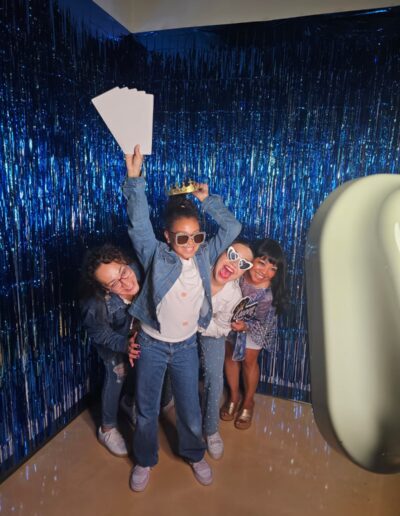 Guests using a modern photo booth rental in Fort Worth